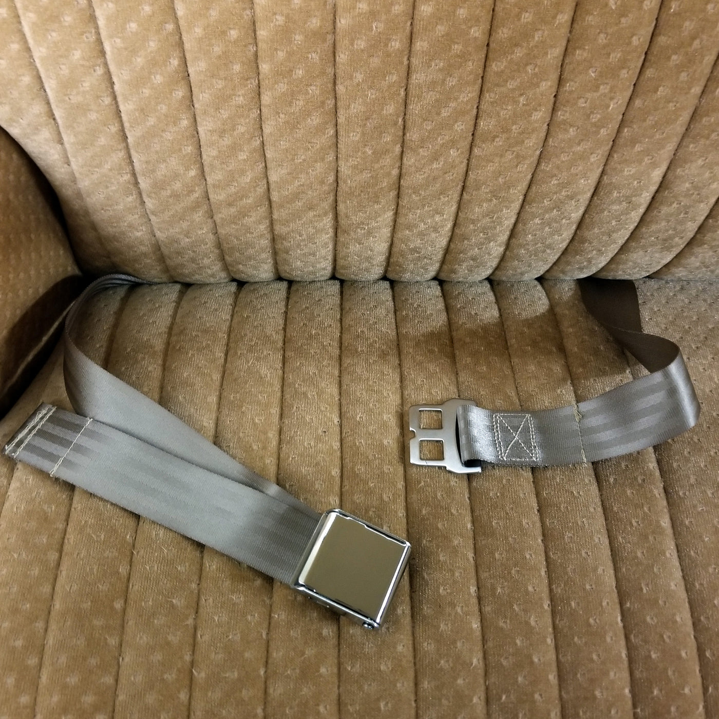 Grey 2-Point Lap Airplane Buckle Seat Belt Installed in Car Interior Bench Seat