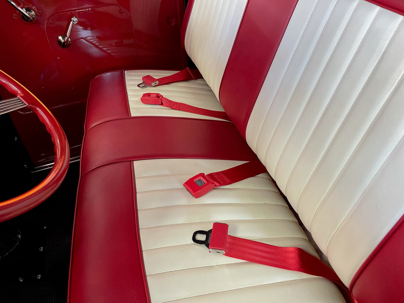 Red Push Button Lap Seat Belts in Interior