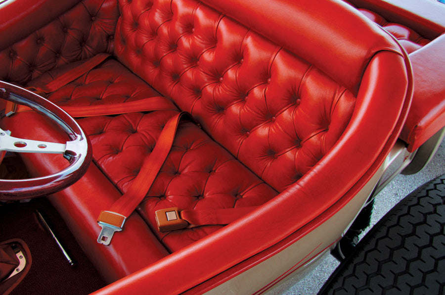 Red Push Button Lap Seat Belts in the Interior of a Hot Rod